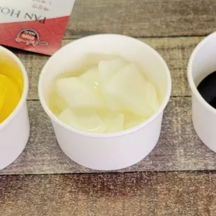 Left: Danmooji (Pickled Radish); Middle: Raw Sliced Onions; Right: Black Sauce