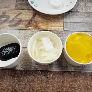 Black bean sauce, onions, and pickled radish