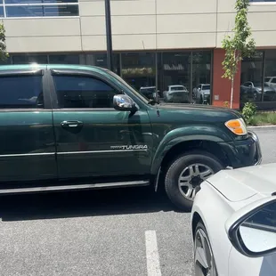 Again, her car blocking mine in and as you can see the FREE parking spot next to mine.