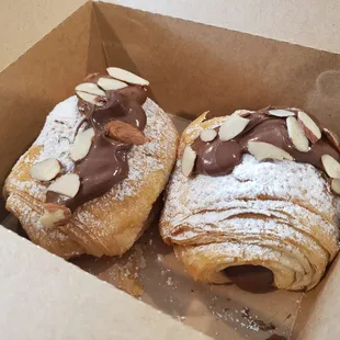 Croissant filled with hazelnut spread, topped upon request.