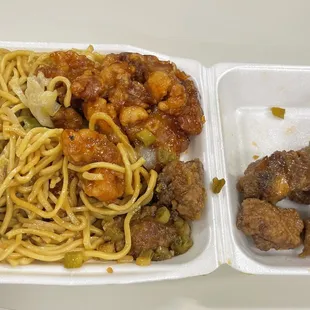 a plate of noodles and meat