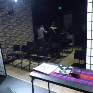 people sitting at tables in a room