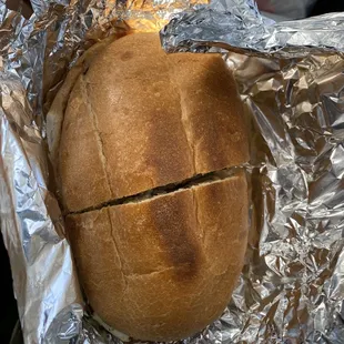 a loaf of bread wrapped in tin foil