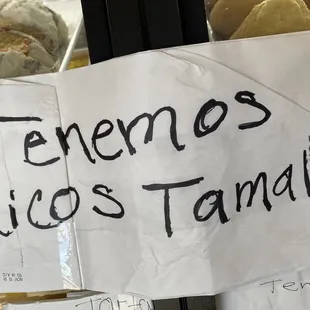 a sign that reads tenemos rice tamales