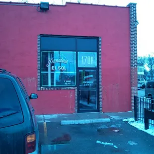 a car parked in front of a restaurant