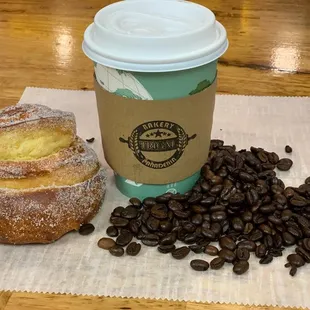 a cup of coffee and a pastry