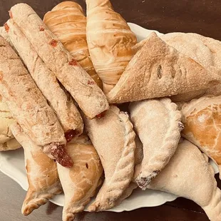 a plate of bread and pastries