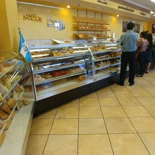 people shopping in a bakery