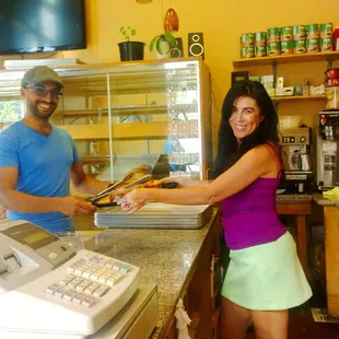 a man and a woman in a bakery