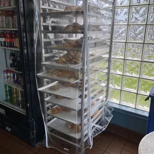 a rack of trays of baked goods
