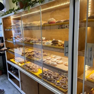 a woman standing in front of a bakery