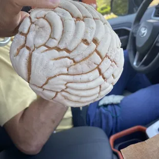a man holding a doughnut in his hand