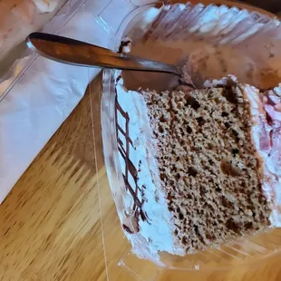 Tres leche with strawberries slices in the middle