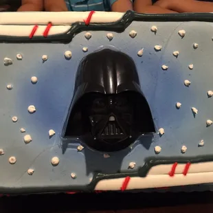 Chocolate cake with fresh peaches and strawberries marmalade! The darth Vader head also talks