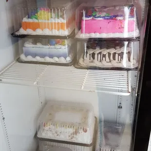 a refrigerator full of cupcakes