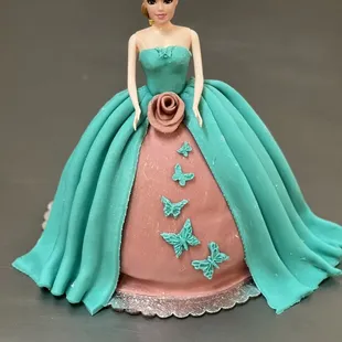 a barbie doll in a blue dress