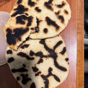 two flatbreads on a table