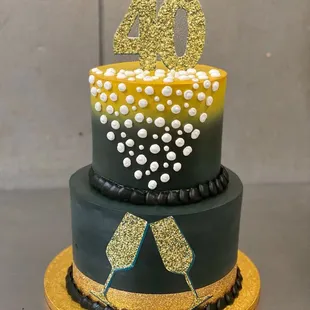 a black and gold birthday cake