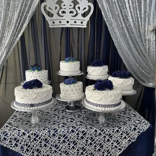 a table with three cakes and a crown