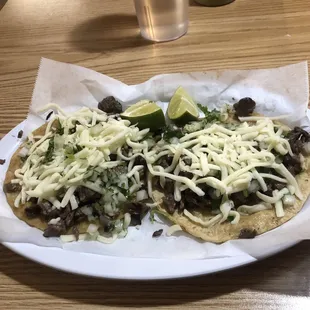 Two carne tacos w queso.  Great portion for $2 each