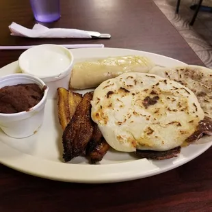 Chicken Pupusa and Bean &amp; Cheese Pupusa w/ tamale, refried beans, and crema