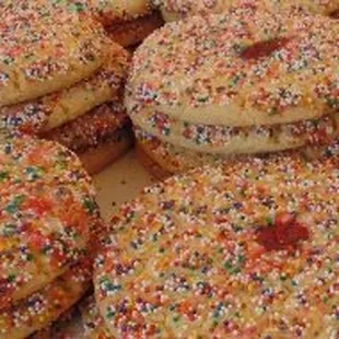 a plate of cookies with sprinkles