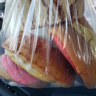 a sandwich wrapped in plastic