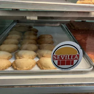 a variety of pastries in a display case