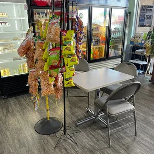 a table and chairs in a grocery store