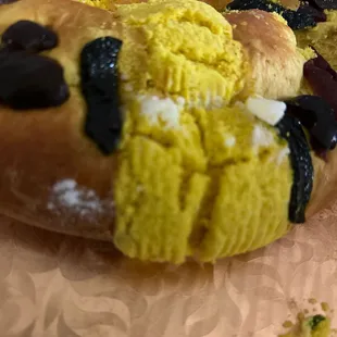 a panaderia doughnut with a bite taken out of it