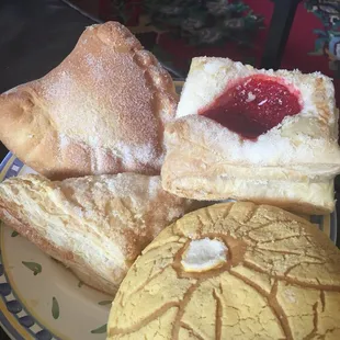 a plate of pastries and bread