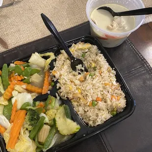a tray of rice and vegetables