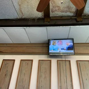 Right above our heads? If you can afford security cameras and TVs, fix your building and clean it.