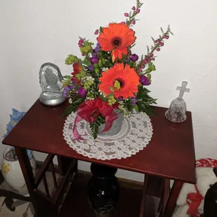 a vase of flowers on a table