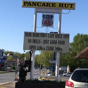 a car parked in front of the sign