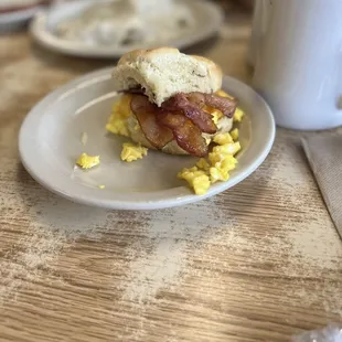 bacon and eggs on a biscuit