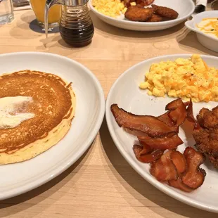 bacon, eggs, hash browns, and pancakes