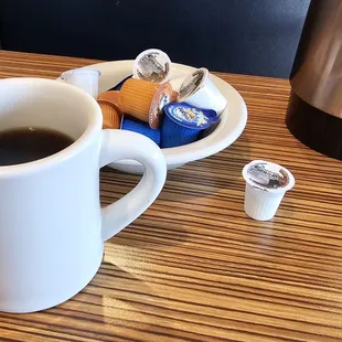 a cup of coffee and a chocolate bar