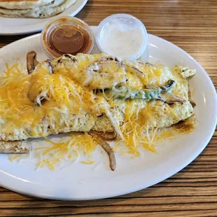 an omelet with cheese and sauce