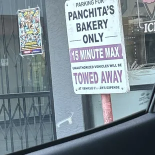 a parking sign for panchitas's bakery