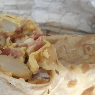 My son has been friends with the owners&apos; for years. Today,  egg, bacon, potato burrito.Yum! $8.35