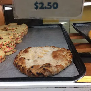 a pizza on a baking sheet