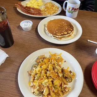 Near: Sausage Chilaquiles. Far: Country Breakfast Platter.