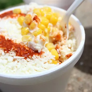 Esquite- Mexican street corn with mayo, cotija cheese and chili powder