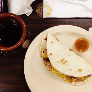 a plate of food and a cup of coffee