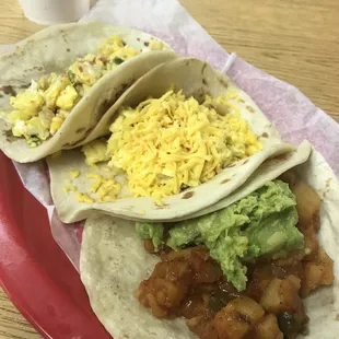 Papa Ranchera with Guacamole, Potato/Egg/Cheese, and Huevos a la Mexicana.