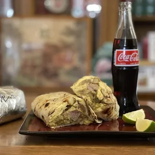 Chili Verde breakfast burrito with an ice cold bottle of Coke.