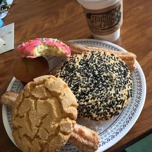 A variety of delicious pastries and a Columbia hot coffee