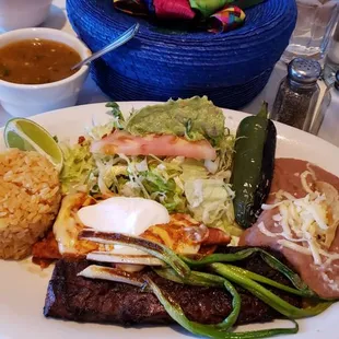 Carne asada a la tampiqueña with enchilada swissa plus peach  margarita.