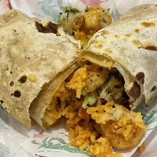 Shrimp burrito busting out with some rice and shrimp laced in pico de gallo sauce!